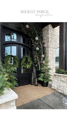 the front entrance to a house with christmas decorations on it and wreaths hanging from the door