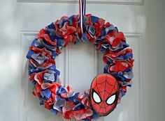 a spiderman wreath hanging on the front door