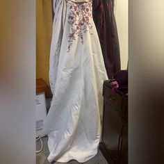 a wedding dress is on display in a room