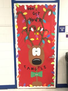 a door decorated with an image of a reindeer wearing a bow tie and saying, don't get your inner tangle