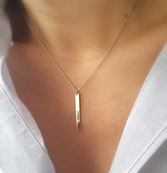 Simple, sleek and unique. This two tone sterling silver chain and 14k gold fill bar necklace can pretty much go with any outfit. This design is a great dress up dress down piece that can easily become your everyday necklace. 14k gold bar is 30 mm x 3 mm. Rollo sterling silver chain and 14k gold fill spring ring clasp. Please make sure to select your desired length in the drop down menu. Model is wearing a 15 inch necklace. Your necklace will arrive in a small jewelry gift box with bow. Minimalist Sterling Silver Bar Necklace With Rectangular Pendant, Sleek White Gold Jewelry Gift, Sleek White Gold Jewelry For Gifts, Sterling Silver Bar Necklace For Everyday, Minimalist Silver Bar Necklace As Gift, Simple Sterling Silver Necklace With Rectangular Pendant, Silver Dainty Bar Necklace For Everyday, Simple Silver Rectangular Pendant Jewelry, Dainty Sterling Silver Bar Necklace For Everyday