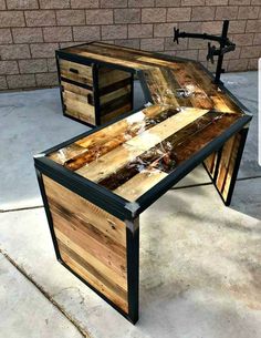 an unusual desk made out of wood and metal is shown in this image, it has been