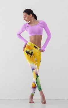 Step into the garden of serenity with our enchanting yoga leggings featuring a mesmerizing pattern of bumblebees dancing among delicate daisies. Crafted for both beauty and comfort, these leggings are more than just apparel; they are an invitation to embrace nature's harmony during your yoga practice or daily adventures. Designed with soft, breathable fabric that moves with you, these leggings offer flexibility and support from downward dog to tree pose. The high-waisted cut provides a flattering silhouette and ensures a secure fit, allowing you to focus on your practice without distractions. Whether you're a yoga enthusiast, nature lover, or simply appreciate unique, eye-catching designs, these leggings are a perfect addition to your wardrobe. They make a thoughtful gift for anyone who va High Waisted Yoga Leggings, Tree Pose, Downward Dog, Legging Outfits, Womens Leggings, Yoga Practice, Nature Lovers, Outfits With Leggings, Yoga Leggings