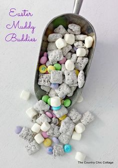 a spoon filled with marshmallows and candy