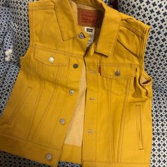 Brand New Levi’s Yellow Denim Marked M 10-12 (Youth) But Could Fit A Women’s 4 Great Over A Shirt With Jeans And Sneakers Or Sweater With A Maxi Skirt Or A Long Sleeve Dress With Riding Boots For Fall. Yellow Denim Jacket With Pockets For Fall, Yellow Cotton Denim Jacket With Pockets, Casual Yellow Denim Jacket With Pockets, Yellow Cotton Denim Jacket For Fall, Casual Mustard Cotton Outerwear, Casual Yellow Denim Jacket, Fitted Yellow Denim Jacket For Fall, Dress With Riding Boots, Shirt With Jeans