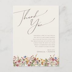 a thank card with flowers on it