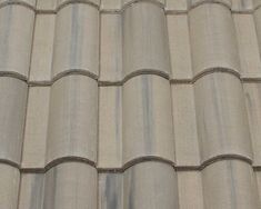 an image of a roof that is made out of concrete tiles and has been cleaned