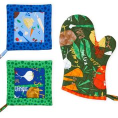 three oven mitts and one pot holder with animals on them, all in different colors