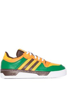 Green/burgundy/yellow leather-blend x Human Made Rivalry sneakers from adidas featuring colour-block panelled design, signature three-stripe logo, branded heel counter, round toe, front lace-up fastening and flat rubber sole. POSITIVELY CONSCIOUS: adidas Group scores 4 out 5 with independent ethical brand rating agency Good On You. It uses eco-friendly materials in many products – 100% of its cotton is from sustainable sources and it's committed to use 100% recycled polyester by 2024. It traces Sporty Multicolor Leather Skate Shoes, Adidas Custom Green Sneakers With Laces, Adidas Custom Leather Low-top Sneakers, Custom Green Adidas Sneakers, Adidas Custom Low-top Leather Sneakers, Sporty Green Adidas Custom Sneakers, Green Lace-up High-top Sneakers With Adidas Logo, Green High-top Sneakers With Adidas Logo And Round Toe, Adidas Custom Green Sporty Sneakers