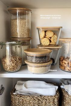 an organized pantry with jars and containers filled with cookies, crackers, muffins and more