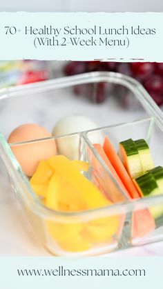 a plastic container filled with fruit and veggies on top of a white table