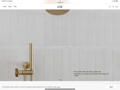 an image of a gold faucet and shower head on the website design for cle