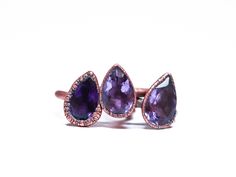 Amethyst ring | Amethyst crystal ring | Purple amethyst and recycled copper ring | Raw crystal jewelry | Amethyst statement ring | Natural amethystThis listing is for one faceted amethyst crystal electroformed to a hand-hammered 12 gauge recycled copper ring. Stones vary but average approximately 13 x 9 mm.If your size is unavailable, please select “custom” from the drop down menu and indicate the size you need at check out.Our jewelry is unique and one-of-a-kind. Please note there will likely b Fine Jewelry Amethyst Crystal Ring With Gemstone Accents, Elegant Amethyst Rings With Stones, Fine Jewelry Amethyst Stackable Rings, Purple Amethyst Jewelry With Rose Cut Diamonds, Fine Jewelry Stackable Amethyst Rings, Purple Rose Cut Diamond Ring As A Gift, Amethyst Gemstone Stackable Rings Fine Jewelry, Gift Jewelry With Rose Cut Diamonds And Amethyst, Unique Amethyst Rings With Gemstone Accents