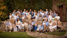 a large group of people posing for a photo