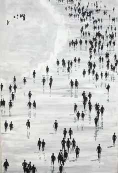 black and white photograph of people walking on the beach