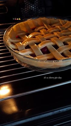 a pie sitting on top of an oven rack in the oven, ready to be baked