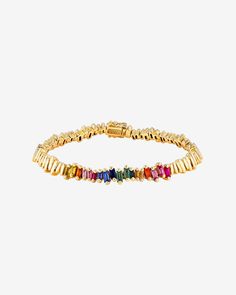 Discover the unique elegance of our Golden Sapphire ID Bracelet, a modern interpretation of a classic style. This bracelet combines the brilliance of 2.10 carats of rainbow sapphire baguettes with 18-karat gold pieces, crafted to mimic the silhouettes of gemstones. Details 18k yellow gold or rose gold 2.10 carats of rainbow sapphire baguettes Bracelet measures 7 inches in length Box clasp with safety lock fastening Embellishment measures 2 inches in length 6.35mm width Ref: AKB570 Baguette Cubic Zirconia Bracelets In Fine Jewelry Style, Baguette Cubic Zirconia Bracelet Fine Jewelry, Luxury Multicolor Baguette Diamond Jewelry, Fine Jewelry With Multicolor Baguette Diamonds, Baguette Bracelet, Rainbow Sapphires, Id Bracelets, Box Clasp, Gold Piece