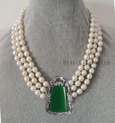 Jewelry: fresh water pear, genuine cultured pearl; Malay green jade, not purely natural jade. Color: white Grade: A+, have natural blemish and growth rings on pearl's surface, just as photos Size: pearl size 8-85mm Shape: rice baroque Length: please choose your needed length Handwork: knotted between every 2 pearl bead Metal: alloy, 18KGP Shipping: I will send out your order in 1-2 business days. Usually will take about 8-20 business days.  Good luck! Elegant Green Pear-shaped Necklace, Elegant Green Necklaces With Pearl Drop, Elegant Green Pearl Drop Necklaces, Elegant Green Jade Pearl Necklace, Elegant Jade Necklace For Wedding, Formal Green Pearl Necklace, Elegant Jade Pearl Necklace For Gift, Elegant White Jade Jewelry, Elegant Green Pearl Necklace With Pendant