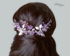 a close up of a woman's head wearing a hair comb with flowers on it