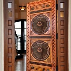 an open door with two bears painted on the front and back doors, leading into a foyer