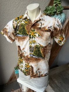 This spectacular, genuine 1970s vintage Hawaiian shirt has lot going including surfers, sailboats, huge waves, breezy palms, thatched huts and more. Excellent fit, feel and condition. Feels like 100% polynesian polyester. SIZE: Pit to Pit: 21" Collar to hem: 25.5" Sleeves: 8" The tag is gone. It fits like a modern men's medium or short large. The male mannequin would be 5'10" 175 lbs. ITEM 1 Vintage Cotton Hawaiian Shirt With Tropical Print, Beach Cotton Camp Shirt With Vintage Print, Beach Camp Shirt With Vintage Print, Cotton Camp Shirt With Vintage Print For Beach, Casual Vintage Print Camp Shirt For Vacation, Vintage Cotton Hawaiian Shirt For Vacation, Hawaiian Vintage Print Beach Shirt, Retro Cotton Hawaiian Shirt With Tropical Print, Vintage Hawaiian Shirt With Short Sleeves For Vacation