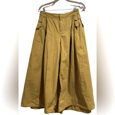 By Anthropologie Pants. These Look Like An Older Version Of The Very Popular Safari Pants. Wide Legs (Looks Like A Skirt). Pleats. Adjustable Side Detailing. Moss Green. Cotton. Size 2. Spring Wide Leg Utility Pants, High Waist Utility Bottoms For Spring, Spring Utility Wide Leg Bottoms, Spring Utility Ankle-length Pants, Utility Wide Leg Bottoms For Spring, Spring Ankle-length Parachute Pants With Belt Loops, Spring Utility Style High-waisted Wide Leg Pants, Spring Utility Style Bottoms, Spring Utility Wide Leg Pants With Belt Loops