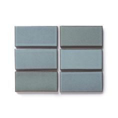 four square tiles are arranged on the wall