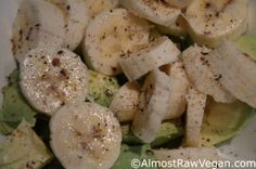 a white plate topped with sliced bananas and lettuce