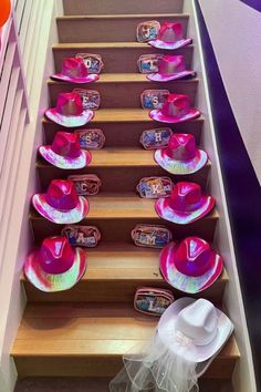 staircase with cowgirl pink cowgirl hats on the stairs, holographic cowgirl hats, white cowgirl hat with a veil, custom make up bags, makeup bags with initial on them, bride cowgirl hat, bachelorette party accessories and gifts Cowgirl Hats Bachelorette, Cowgirl Bachelorette Party Outfits, Bachelorette Goodies, Bachelorette Goodie Bags, Bachelorette Inspo, Bachelorette Party Accessories, Cowgirl Bachelorette Parties, Bachelorette Party Weekend