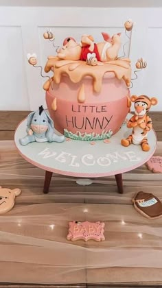 a cake with winnie the pooh on it