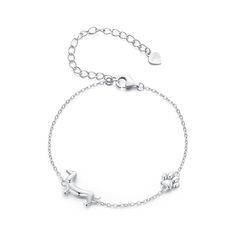 a silver bracelet with an animal charm on the front and back, sitting on a white background