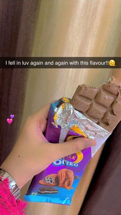 someone is holding some kind of chocolate bar in their hand and it says, i fell in luv again and again with this flavor