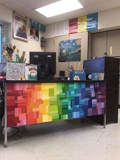 an office cubicle decorated in rainbow colors