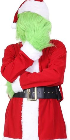 the grin costume is wearing a santa hat and green hair, with his arms crossed