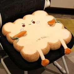 a stuffed animal sitting on top of a black chair