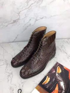 These arethe flagship of ITalian handmade production. Genuine crocodile ankle boots. Side zipper fastening. Metal badge on the heel. Anti-slip rubber add ons on genuine leather sole. Leather lining.[custom tab] UPPER: 100% CROCODYLUS MISSISSIPIENSIS + SOLE: 100% LEATHER SOLE + FILLING: 100% CALF LEATHER [/custom tab] Business Boots With Crocodile Pattern And Round Toe, Leather Ankle Boots With Crocodile Pattern, Alligator Dress Shoes, Embroidered Loafers, Alligator Boots, Black Shoes Men, Winter Leather Boots, Suede Moccasins, Cow Skin