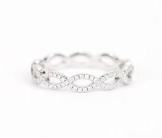 a white gold ring with diamonds on it