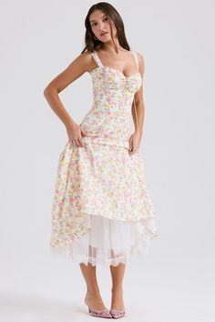 This dress is cut from stretch cotton that's bursting with elegant florals. It has a gathered bust with a corseted bodice and the skirt falls beautifully from the cinched waist. There's a pretty lace trim that peeks below the hemline. The soft tulle underskirt enhances the ultra feminine silhouette making it the perfect Garden Party dress for warmer days. Midi Sundress, Cotton Sundress, Langer Rock, Soft Tulle, Suspender Dress, Mid Length Skirts, Sweet Floral, Bustiers, Tea Dress