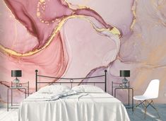 a bedroom with pink and gold paint on the wall