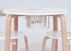 a table with two chairs and a bucket on it that says life & ruiner