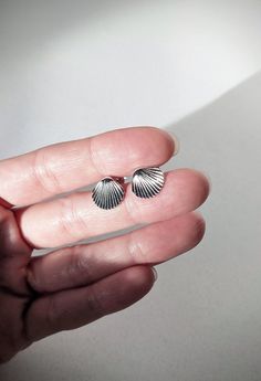 + DETAILS + These are the perfect pair of little shell stud earrings! Very cute and 100% sterling silver. They come with sterling silver backs.  CONDITION: Perfect vintage condition. MARK: 925 (indicating Sterling silver) SIZE: about  1/2 inch or 12 cm. CIRCA: 1980-200s. MATERIAL: 100% Sterling Silver. If you have any questions please feel free to message or email me! Thanks for stopping by! Clam Pearl, Sea Shell Earrings, Vintage Sea, Natural Gifts, Shell Earrings, Sterling Silver Studs, Sea Shell, Silver Studs, Jewelry Earrings Studs