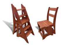 two wooden chairs sitting next to each other