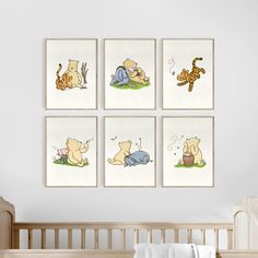 four winnie the pooh wall art prints hanging in a child's nursery room