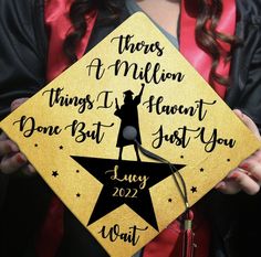 a woman holding a graduation cap that says, there's a million things i haven't done but just you