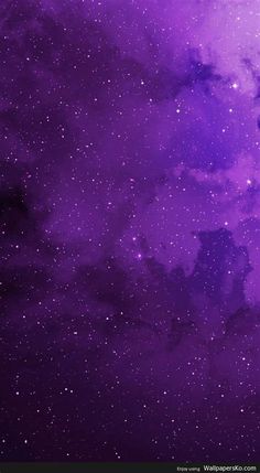 the night sky is filled with stars and purple hues, as well as dark clouds