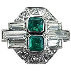 Platinum Art Deco Emerald and Diamond, vintage ring, handmade in England circa 1920. Central emeralds 0.70 carats (total), Columbian, natural untreated colour with very minor inclusions. The emeralds surrounded by differing cuts of diamonds (baguettes, tapered baguettes and old mine) with a total diamond weight of approximately 0.95 carats, F/G/H colour, VS1-SI1. Dimensions of ring head: Length: 17mm Width : 14mm Ring Size: N 1/2 (UK) 7 (US) 14 (FR/JP) Complimentary resizing to fit your requirem 1920s Engagement Ring, 1920 Art, 1920 Art Deco, Art Deco Emerald, Columbian Emeralds, Victorian Engagement Rings, Emerald And Diamond Ring, Art Deco Diamond Rings, Platinum Diamond Rings