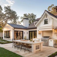 an outdoor kitchen and dining area is shown