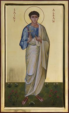 an icon of jesus holding a cross in his hands and standing on the ground with flowers