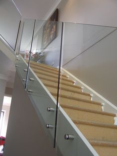 glass railings on the side of a stair case