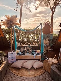 a table with pillows and decorations on it